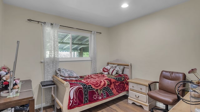 bedroom featuring wood finished floors and recessed lighting