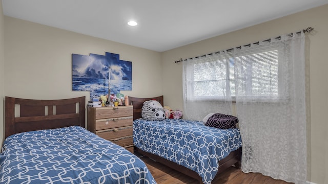 bedroom featuring wood finished floors and recessed lighting