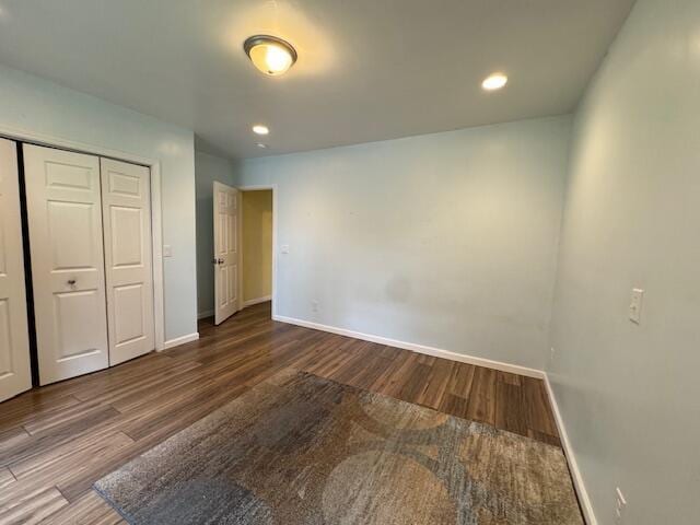 205 Wren Rd, Sturgis, MI 49091 - unfurnished bedroom featuring baseboards, wood finished floors, a closet, and recessed lighting