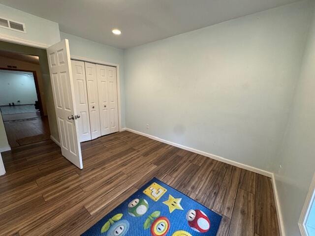205 Wren Rd, Sturgis, MI 49091 - unfurnished bedroom with baseboards, wood finished floors, recessed lighting, and a closet