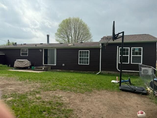 205 Wren Rd, Sturgis, MI 49091 - back of house featuring a yard