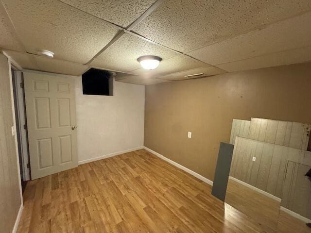 205 Wren Rd, Sturgis, MI 49091 - finished basement with wood finished floors, a paneled ceiling, and baseboards