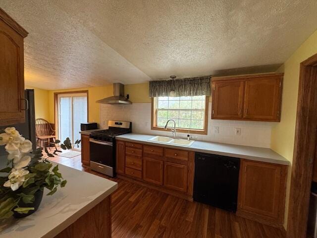 205 Wren Rd, Sturgis, MI 49091 - kitchen featuring a sink, stainless steel range with gas cooktop, black dishwasher, wall chimney range hood, and a textured ceiling