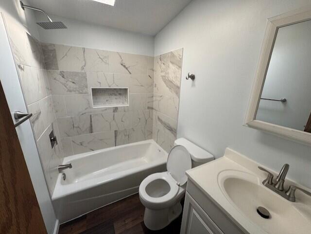 205 Wren Rd, Sturgis, MI 49091 - bathroom with wood finished floors, vanity, toilet, and shower / bath combination