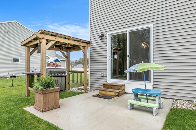 view of patio with area for grilling and entry steps