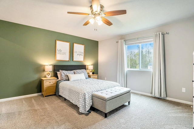 bedroom with light carpet, baseboards, and ceiling fan