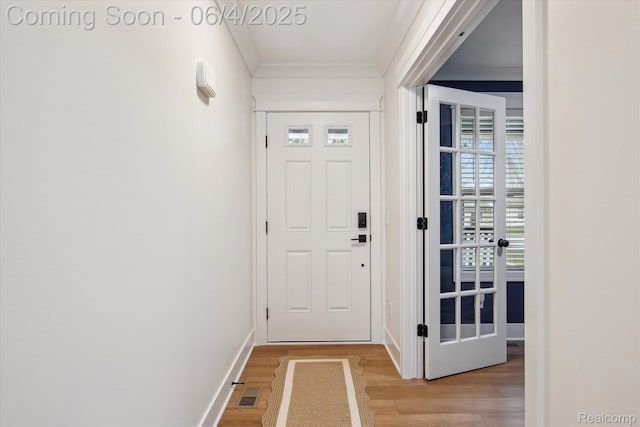9405 Northern Ave, Plymouth, MI 48170 - entrance foyer featuring light wood-style flooring, crown molding, and baseboards