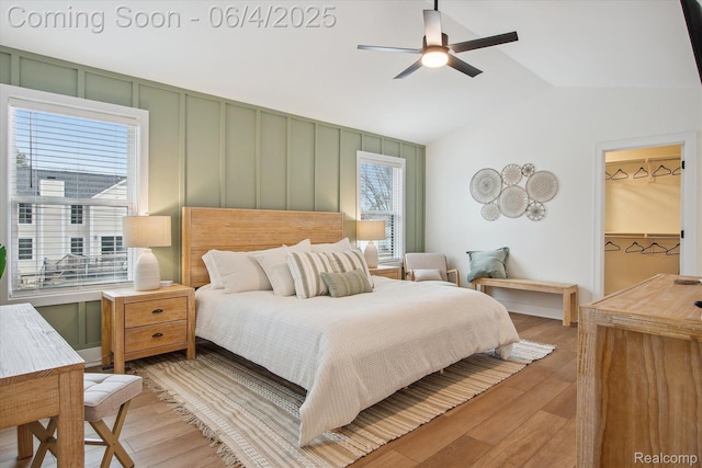 9405 Northern Ave, Plymouth, MI 48170 - bedroom with vaulted ceiling, light wood finished floors, a ceiling fan, and a decorative wall