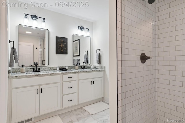 9405 Northern Ave, Plymouth, MI 48170 - bathroom featuring marble finish flooring, tiled shower, and double vanity