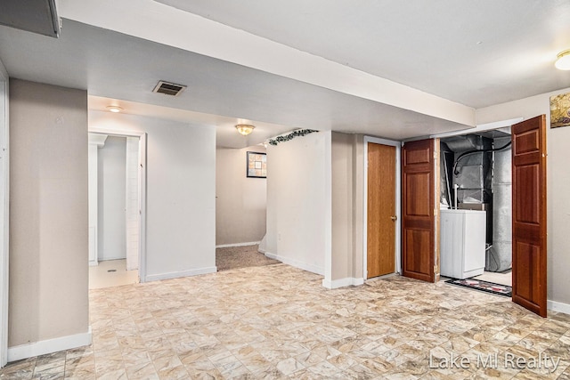 finished below grade area with baseboards and washer / dryer