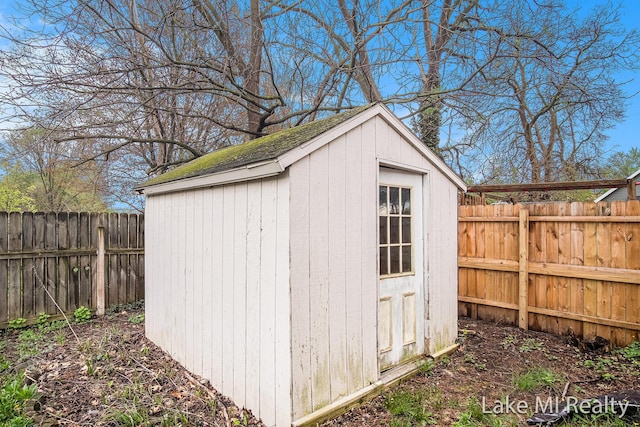 view of shed featuring a fenced backyard
