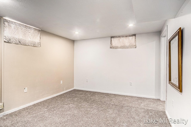 finished basement with carpet, recessed lighting, and baseboards