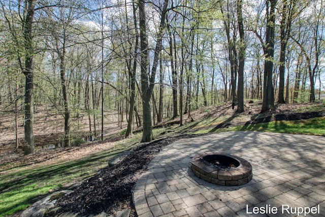 view of patio with an outdoor fire pit