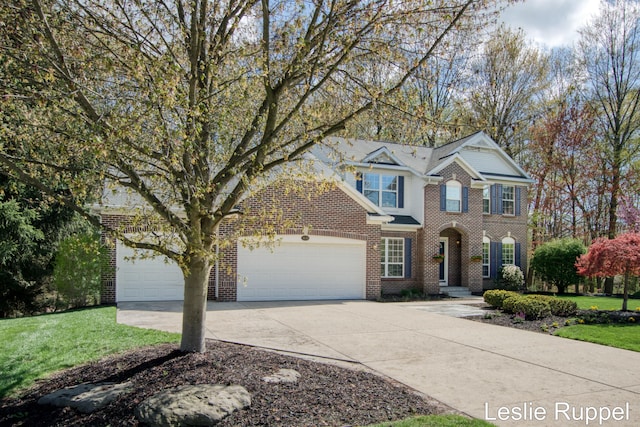 traditional home featuring brick siding, concrete driveway, a garage, and a front yard