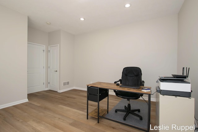 office area featuring baseboards, light wood-style flooring, and recessed lighting