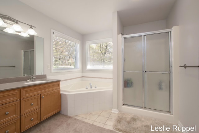 full bath with a shower with shower door, vanity, tile patterned floors, and a bath