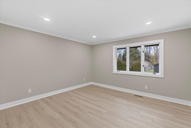 unfurnished room with baseboards, light wood-style floors, recessed lighting, and crown molding