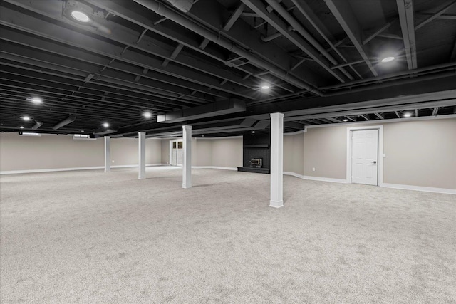 finished below grade area featuring carpet and baseboards