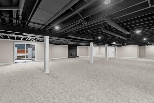 below grade area with carpet floors and baseboards