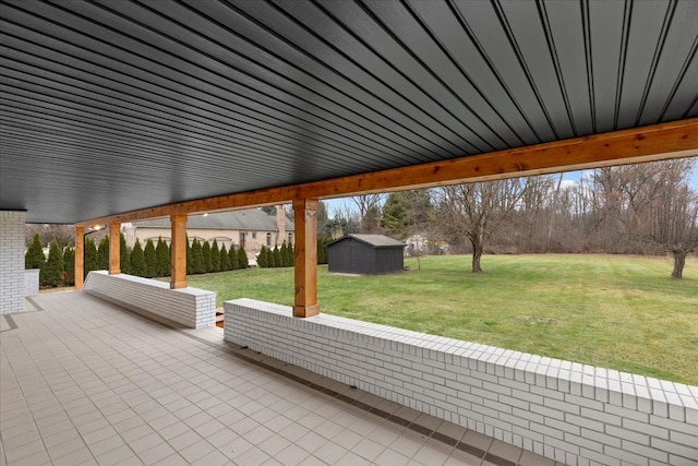 view of patio with a storage shed and an outdoor structure