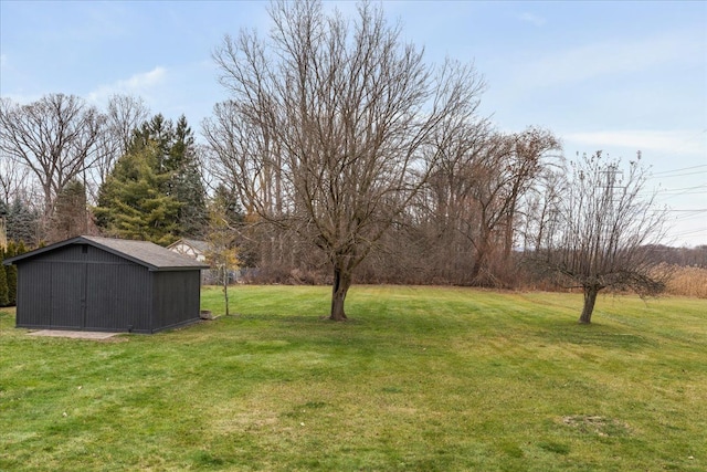 view of green lawn with an outdoor structure