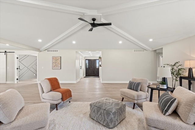 living area featuring a barn door, light wood-type flooring, baseboards, recessed lighting, and ceiling fan
