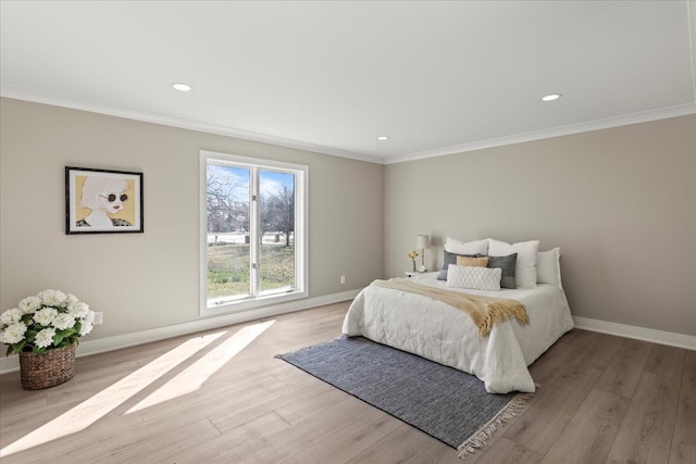 bedroom featuring crown molding, baseboards, light wood-style flooring, and recessed lighting