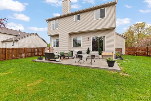 back of property featuring a patio and a chimney