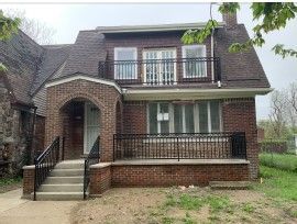 4291 Cortland St, Detroit, MI 48204 - view of front of home with a balcony, brick siding, and a chimney