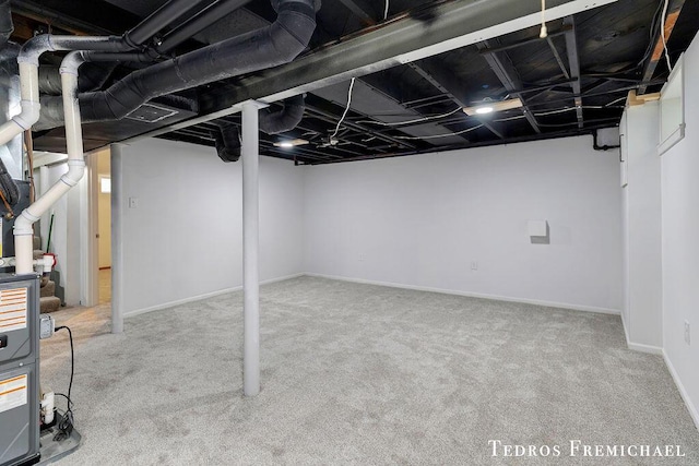 finished below grade area featuring carpet floors and baseboards
