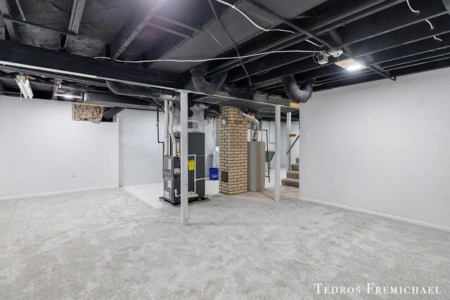 finished basement with stairway, heating unit, baseboards, water heater, and carpet floors