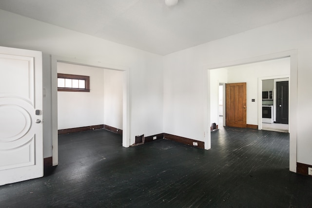 551 Algonquin St, Detroit, MI 48215 - spare room with wood finished floors and baseboards