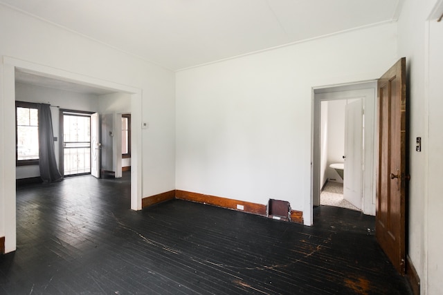 551 Algonquin St, Detroit, MI 48215 - empty room with dark wood-type flooring and baseboards