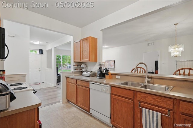 16490 Norfolk Dr, Macomb, MI 48044 - kitchen featuring dishwasher, a sink, light countertops, and brown cabinets