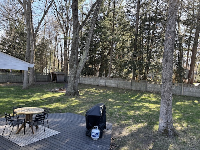 1335 N Sherman Rd, Ludington, MI 49431 - view of yard with a deck, a storage shed, outdoor dining space, and an outdoor structure