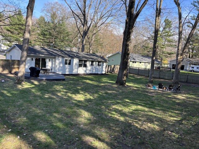 1335 N Sherman Rd, Ludington, MI 49431 - view of yard with a wooden deck and a fire pit
