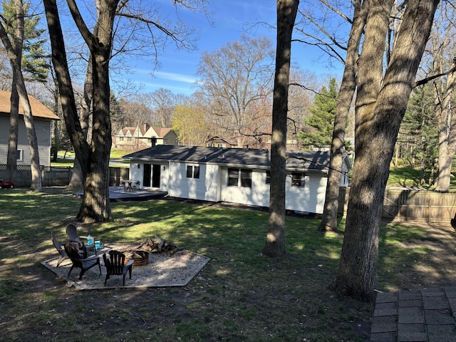1335 N Sherman Rd, Ludington, MI 49431 - back of house featuring a fire pit and a wooden deck