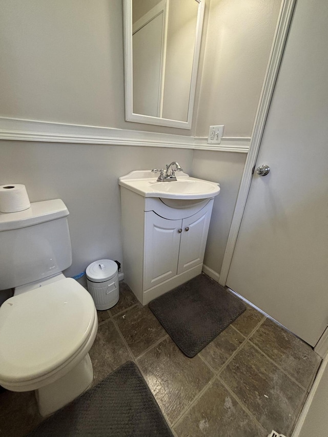 1335 N Sherman Rd, Ludington, MI 49431 - bathroom with toilet and vanity