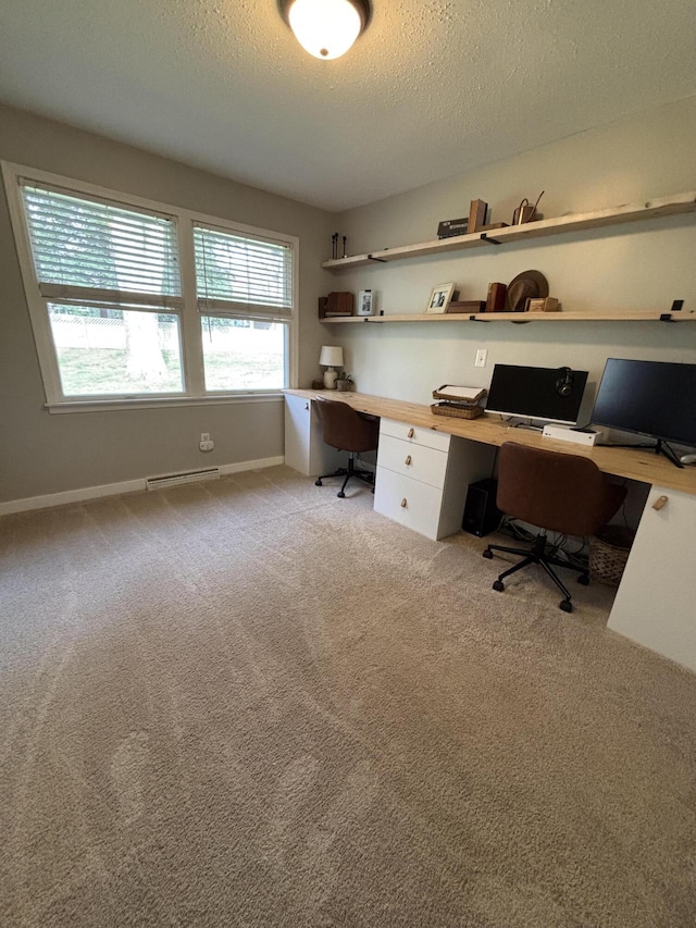 1335 N Sherman Rd, Ludington, MI 49431 - office area with built in desk, a textured ceiling, light carpet, and baseboards