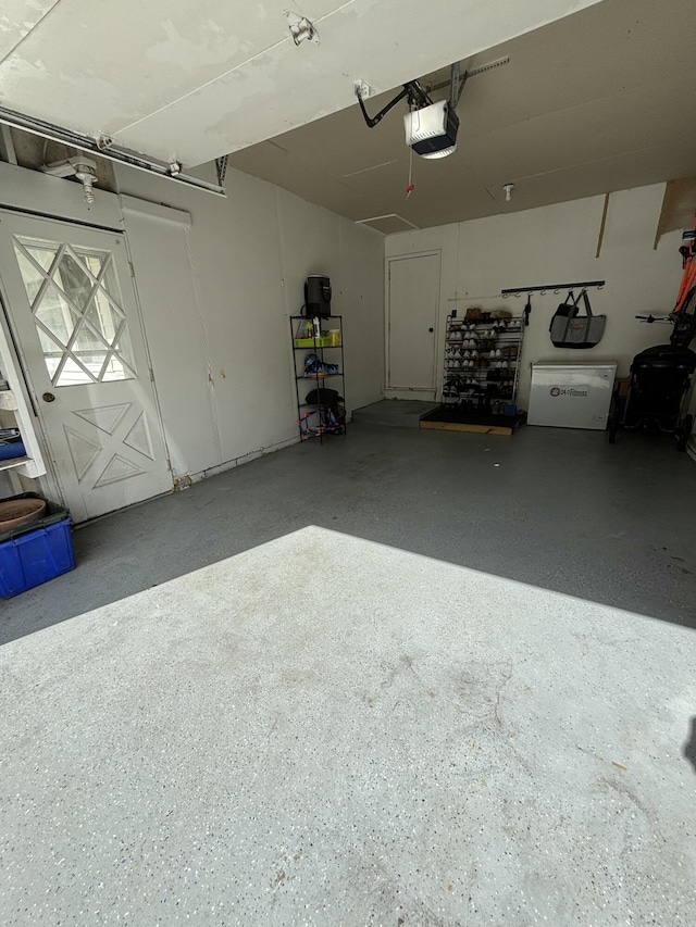 1335 N Sherman Rd, Ludington, MI 49431 - garage featuring a garage door opener