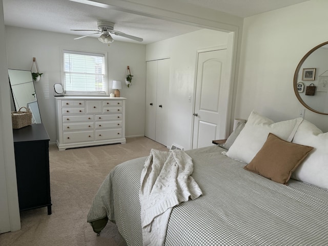 1335 N Sherman Rd, Ludington, MI 49431 - bedroom featuring light carpet, a closet, and ceiling fan