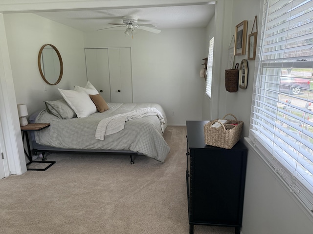 1335 N Sherman Rd, Ludington, MI 49431 - carpeted bedroom with a closet and ceiling fan