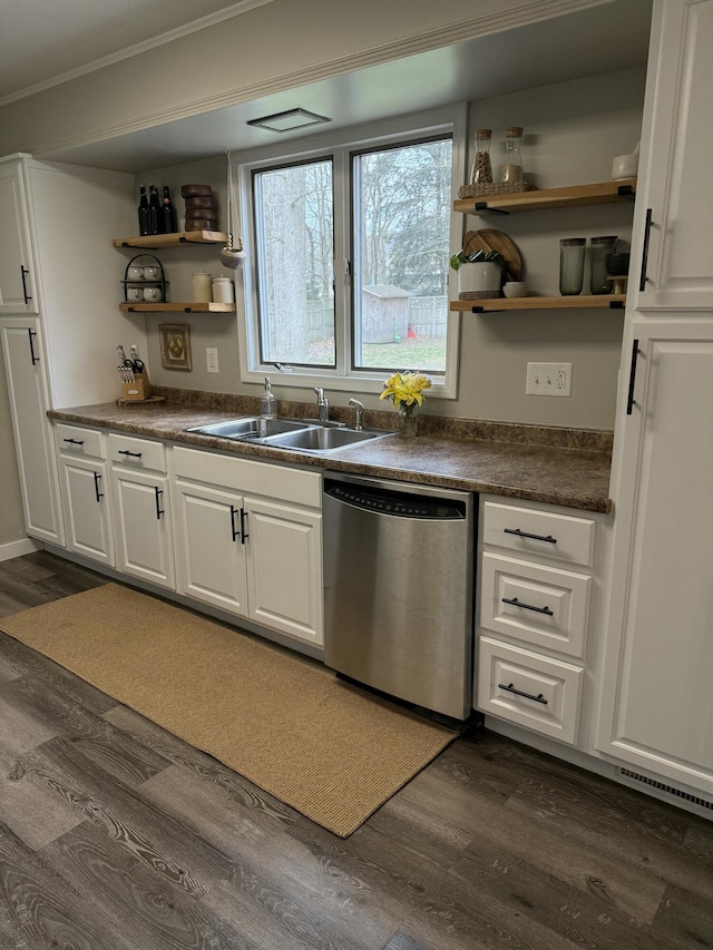 1335 N Sherman Rd, Ludington, MI 49431 - kitchen featuring dishwasher, a sink, open shelves, dark countertops, and ornamental molding