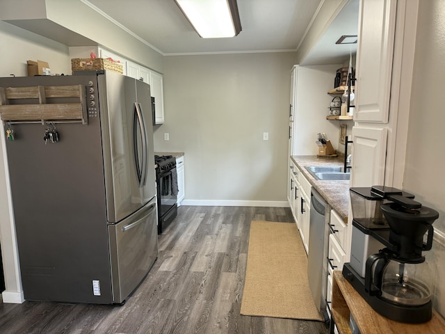 1335 N Sherman Rd, Ludington, MI 49431 - kitchen with appliances with stainless steel finishes, dark wood-type flooring, white cabinets, crown molding, and baseboards