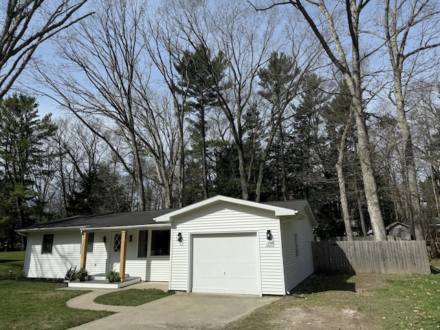 1335 N Sherman Rd, Ludington, MI 49431 - ranch-style home featuring an attached garage and concrete driveway