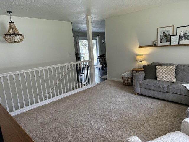 1335 N Sherman Rd, Ludington, MI 49431 - living room featuring carpet and baseboards