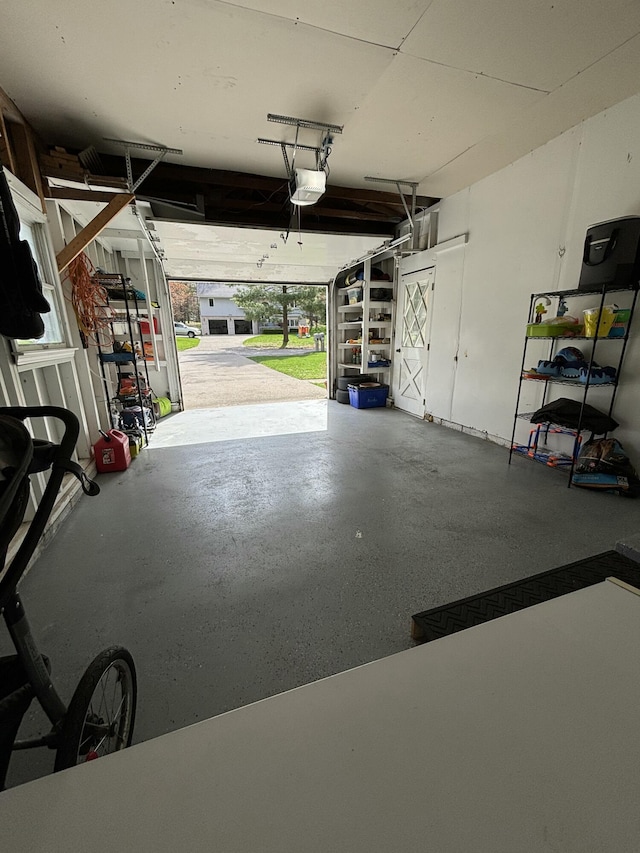 1335 N Sherman Rd, Ludington, MI 49431 - garage featuring a garage door opener