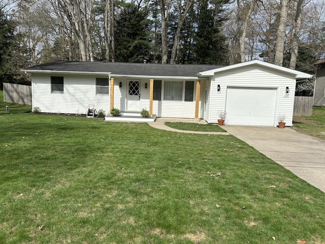 1335 N Sherman Rd, Ludington, MI 49431 - ranch-style home with an attached garage and concrete driveway