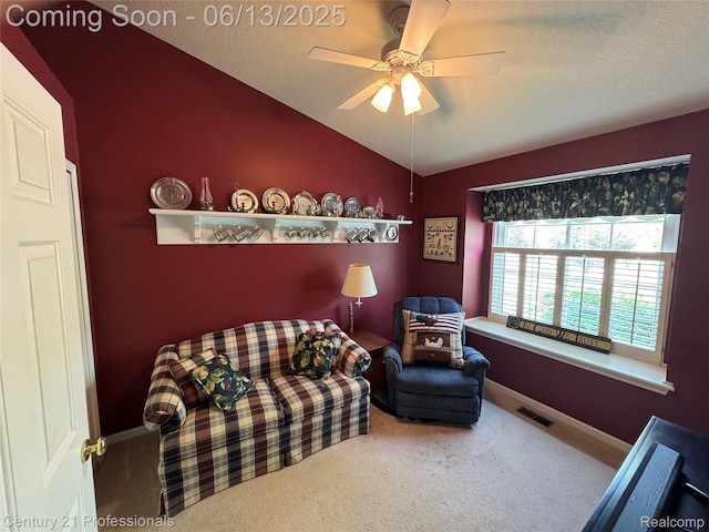 4522 Willow View Ct, Howell, MI 48843 - sitting room with lofted ceiling, carpet floors, ceiling fan, baseboards, and a textured ceiling