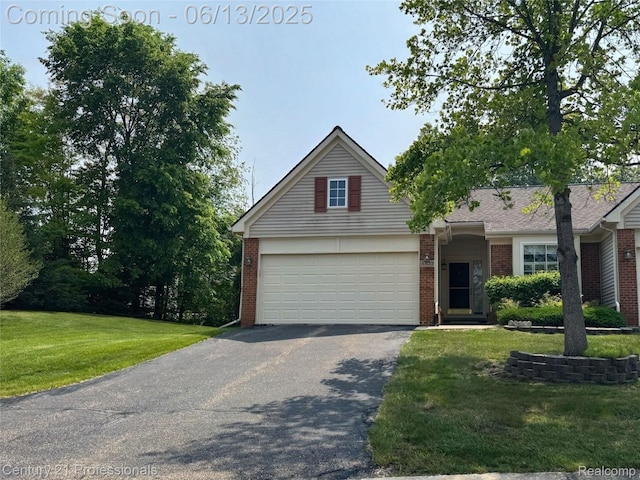 4522 Willow View Ct, Howell, MI 48843 - view of front of house with driveway, brick siding, a front yard, and an attached garage